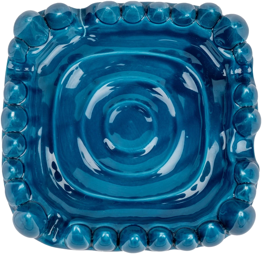 Close detail of the glossy blue ceramic tray