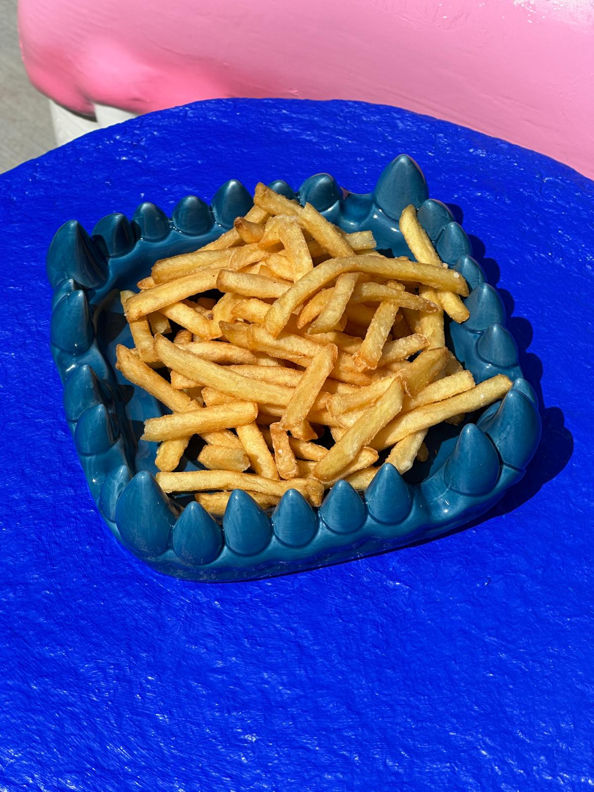 Flesh and Flowers tray used on a bright blue surface
